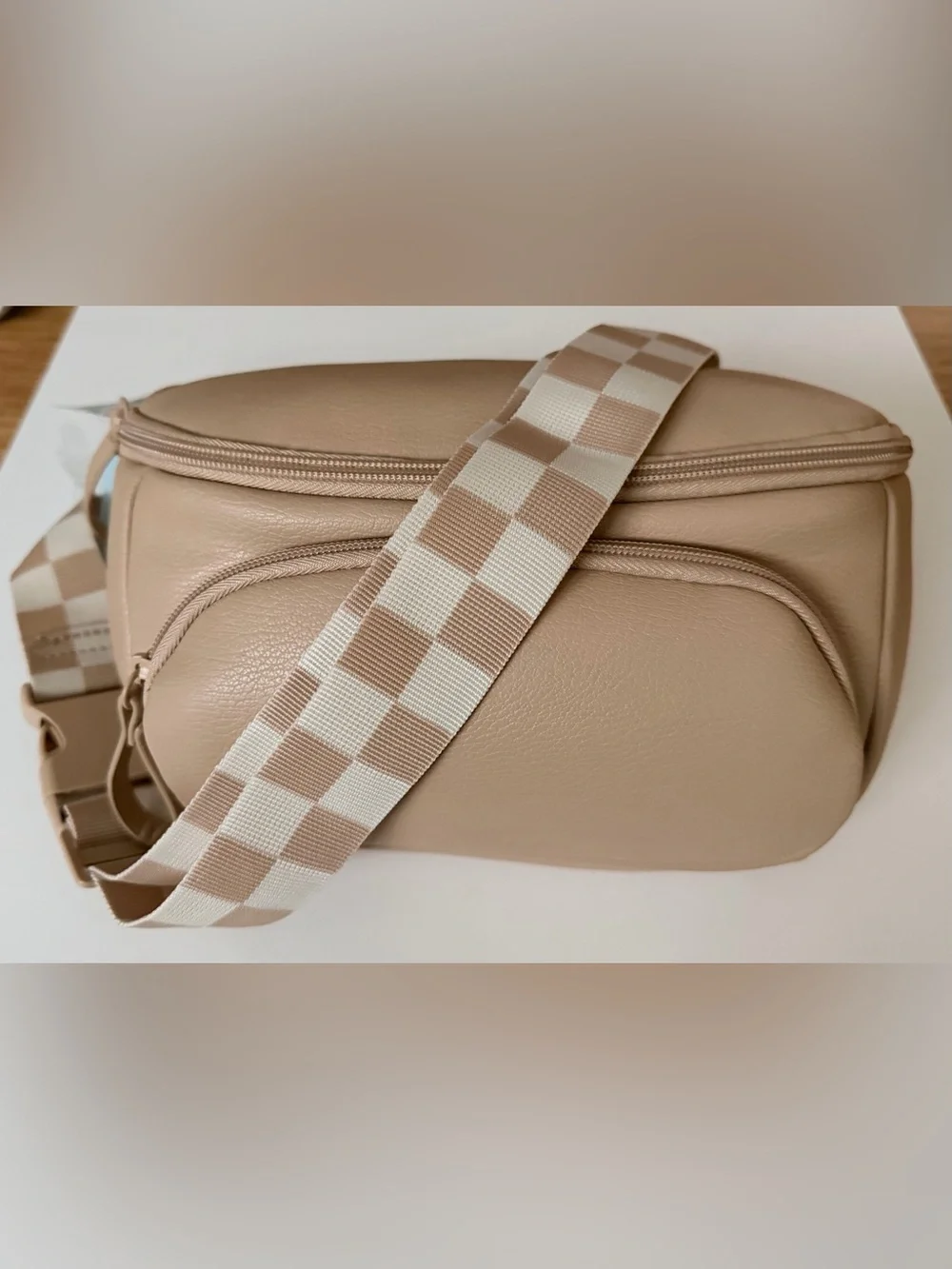 Cloud Island diaper sling in tan with checkered strap